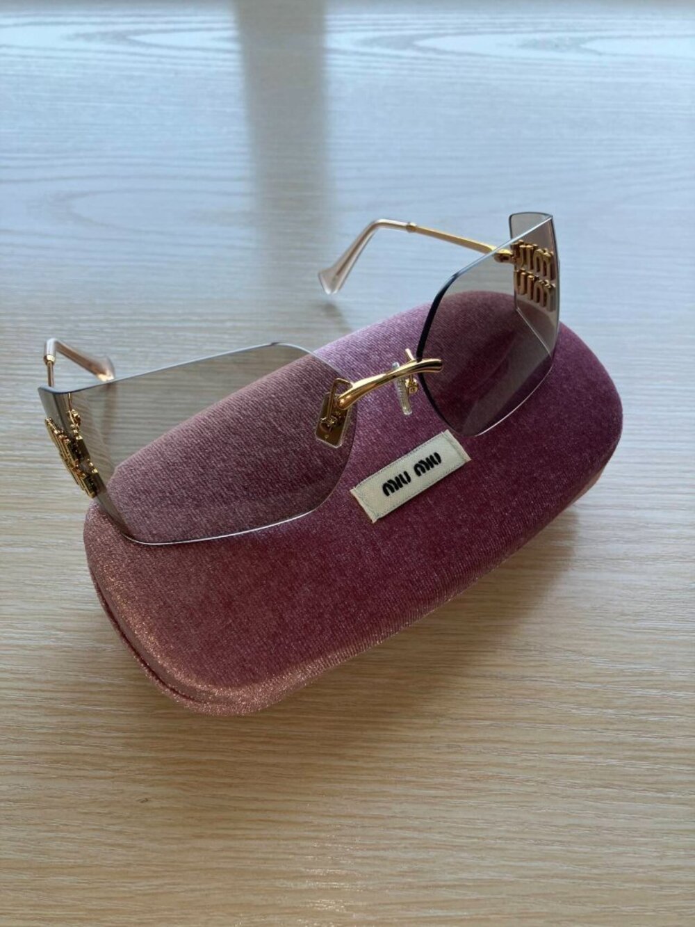 Miu Miu MU54YS Gold Logo Rimless Sunglasses